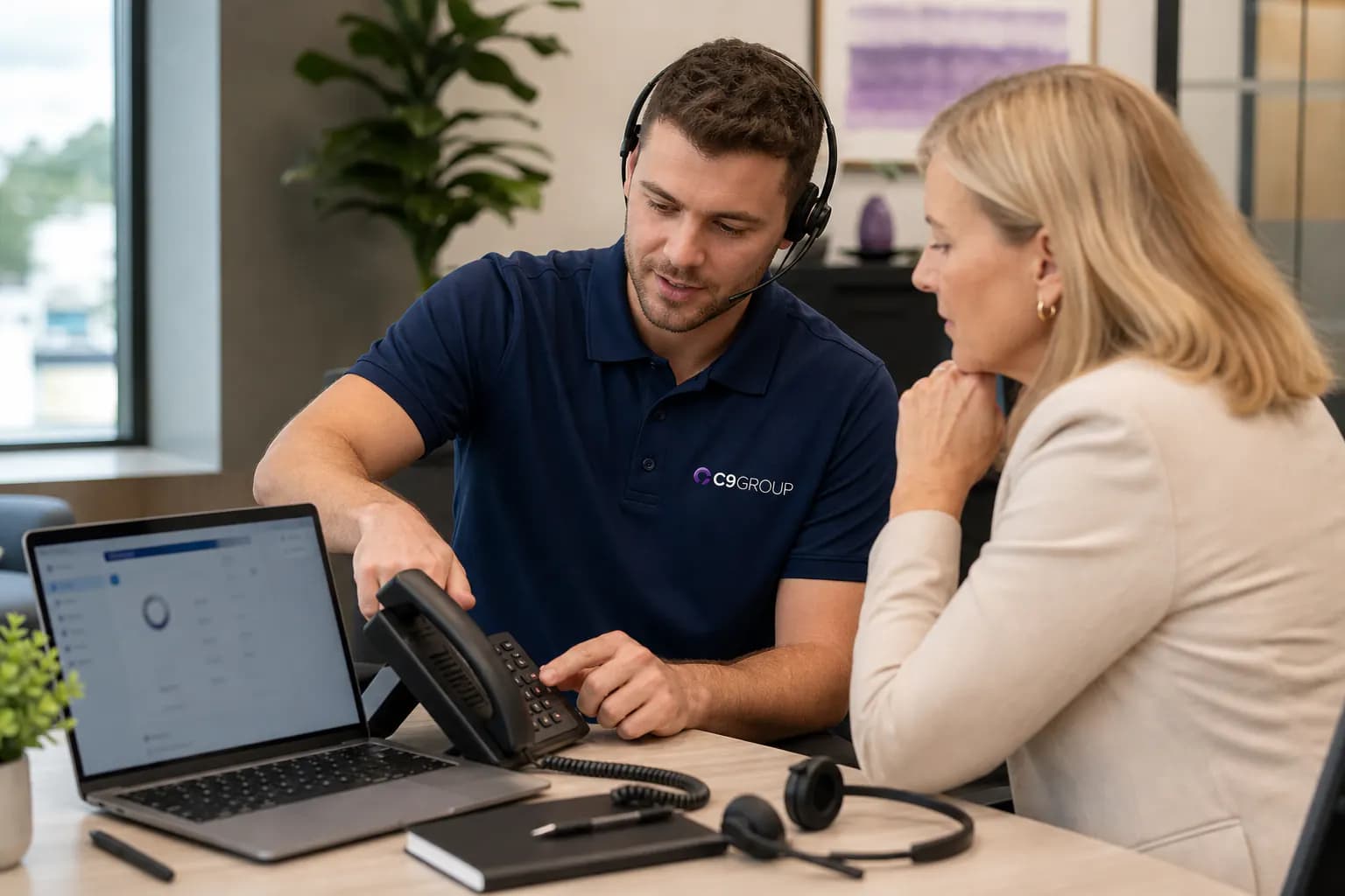 C9 GROUP voice specialist reviewing existing phone system and network requirements onsite